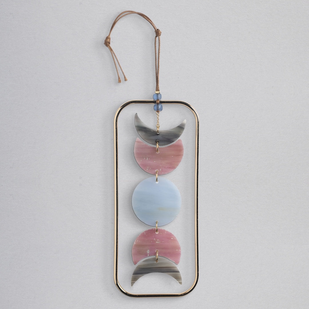 Scout stained glass light catcher with moon phase design in gray, pink and blue crescents