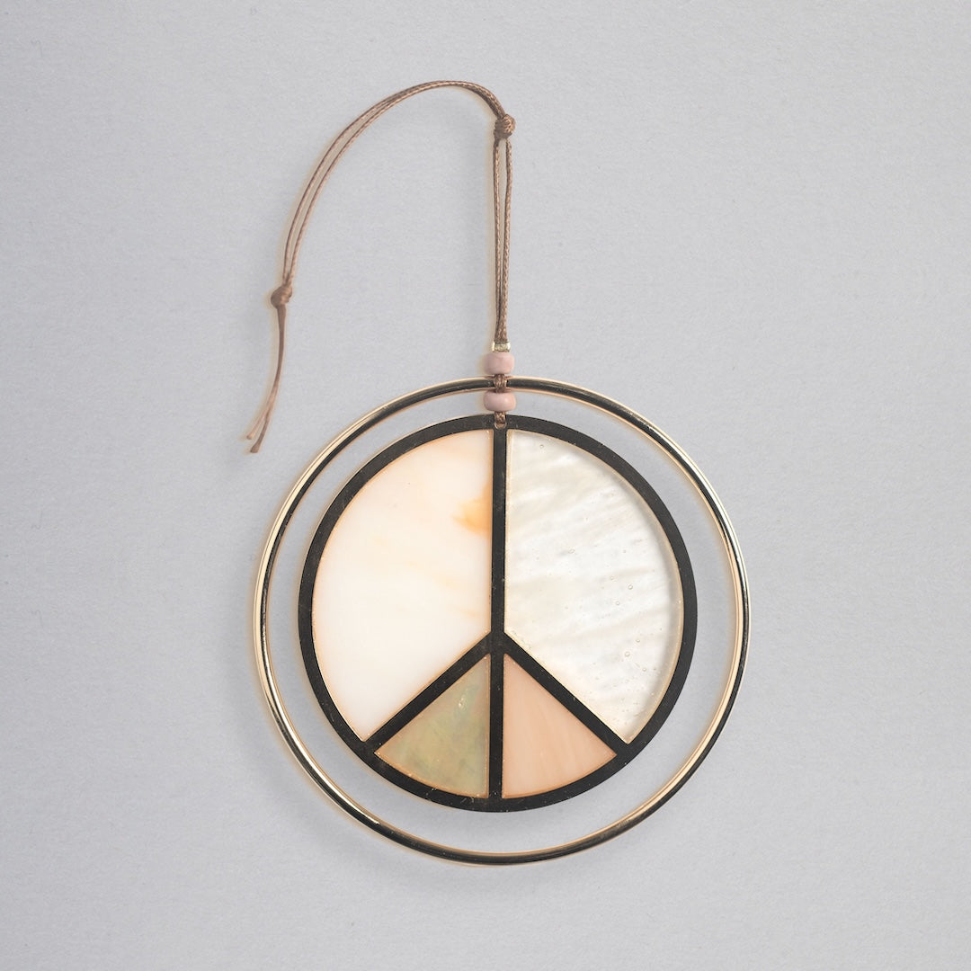 Scout stained glass light catcher featuring peace sign design in cream, peach, and green colors