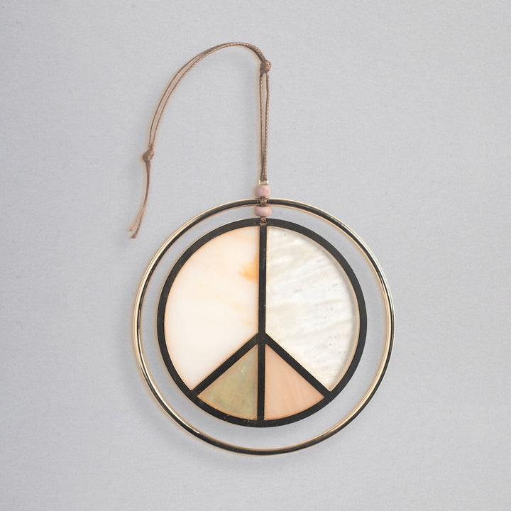 Scout stained glass light catcher featuring peace sign design in cream, peach, and green colors
