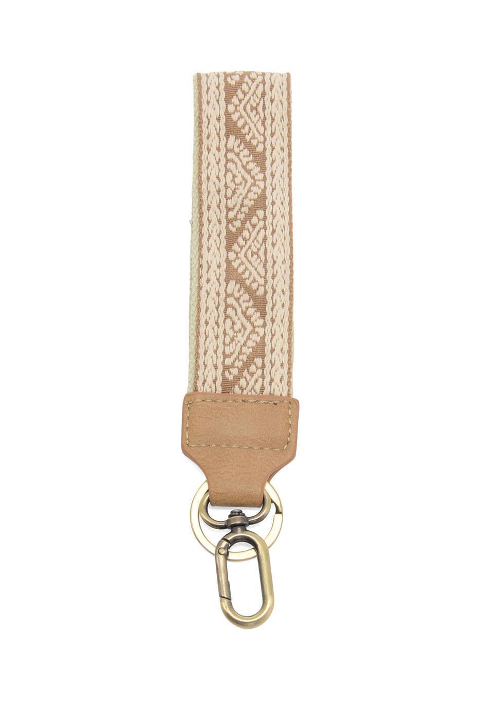 Tan geometric woven wristlet keychain with leather tab and brass swivel clip