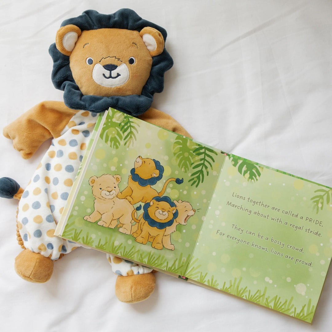 Bunnies By the Bay Critter Crews Board Book open to lion page beside matching lion plush toy