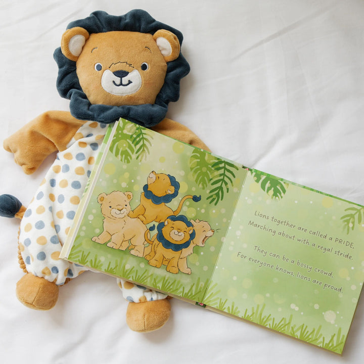 Bunnies By the Bay Critter Crews Board Book open to lion page beside matching lion plush toy