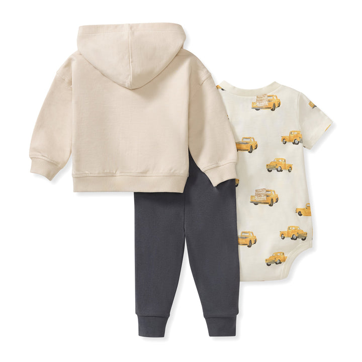 Back view of Burt's Bees Baby 3-piece set with hoodie, pants, and truck-print bodysuit