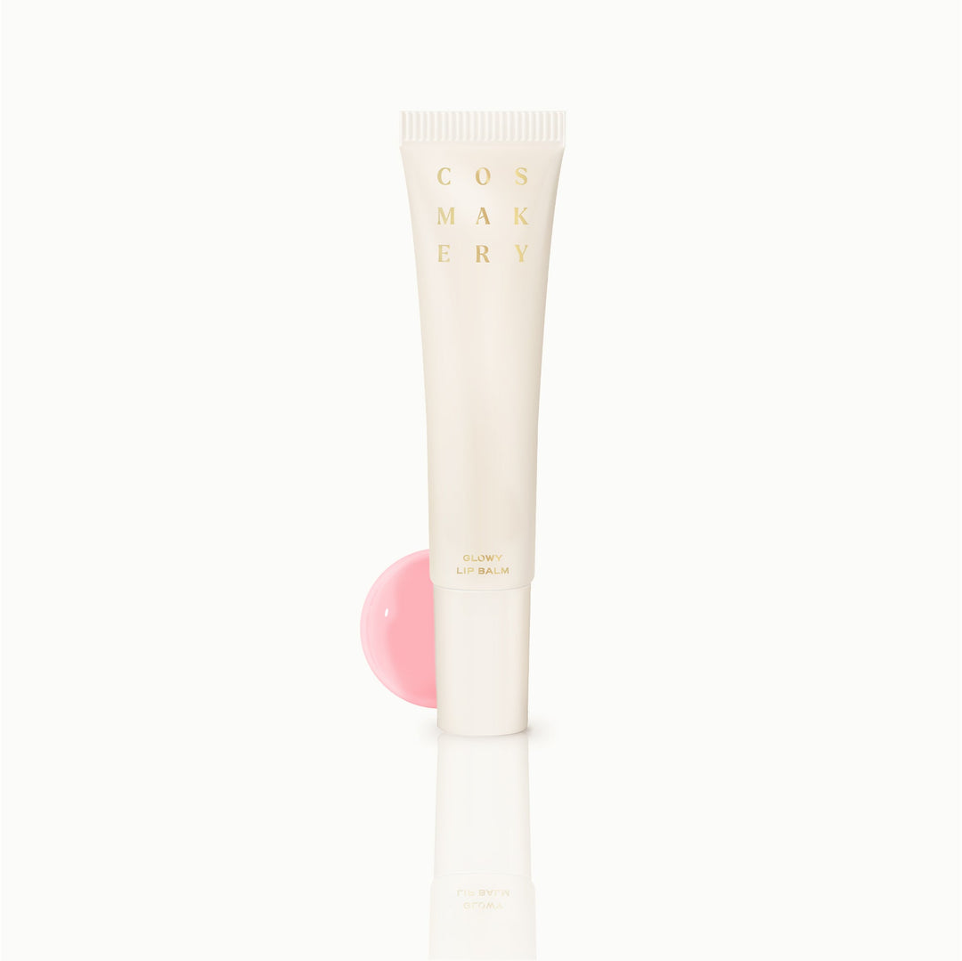 Cosmakery Glowy Lip Balm in pink coral shade with clean white background