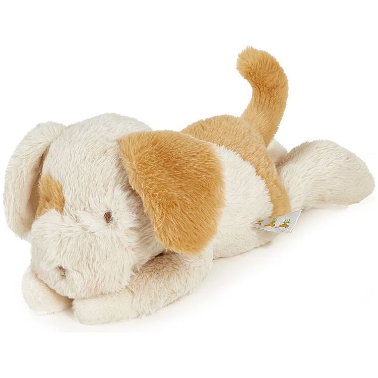 Plush puppy stuffed animal in cream and golden brown lying on side