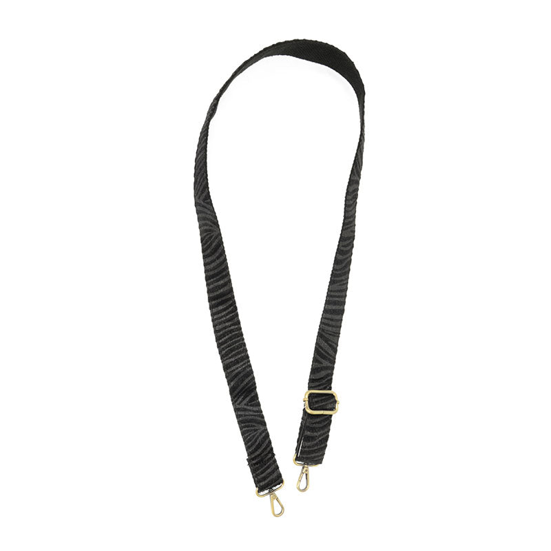 Black zebra print adjustable purse strap with gold hardware and swivel clips