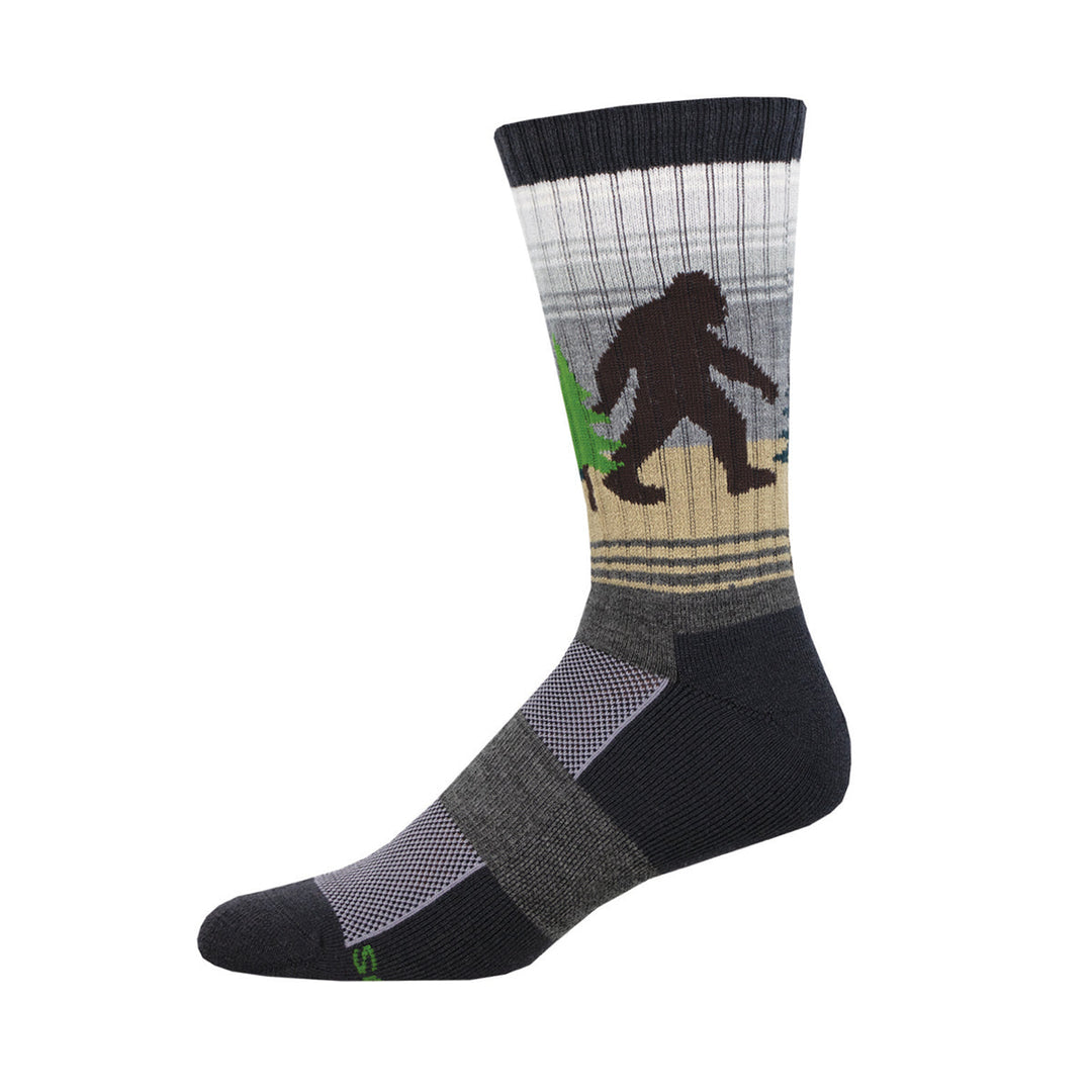 Socksmith gray wool crew socks featuring a Bigfoot Sasquatch silhouette walking through forest design