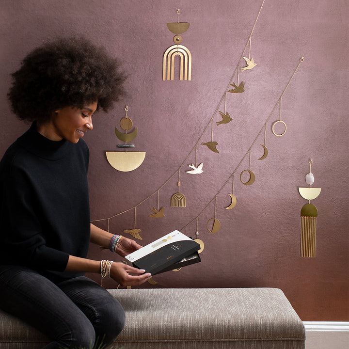 Scout hanging garland with gold metallic birds, moons, rainbows and geometric shapes