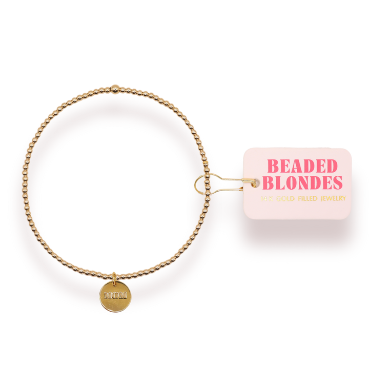 Beaded Blondes gold-filled beaded bracelet with Mom charm on mauve color card