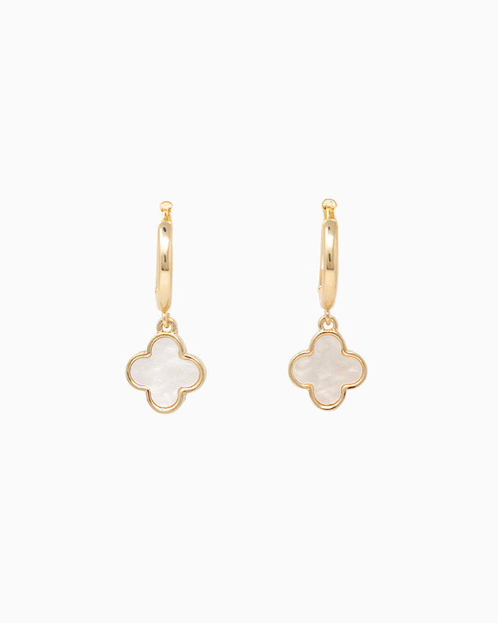 Gold hoop earrings with white mother of pearl four-leaf clover charm pendants