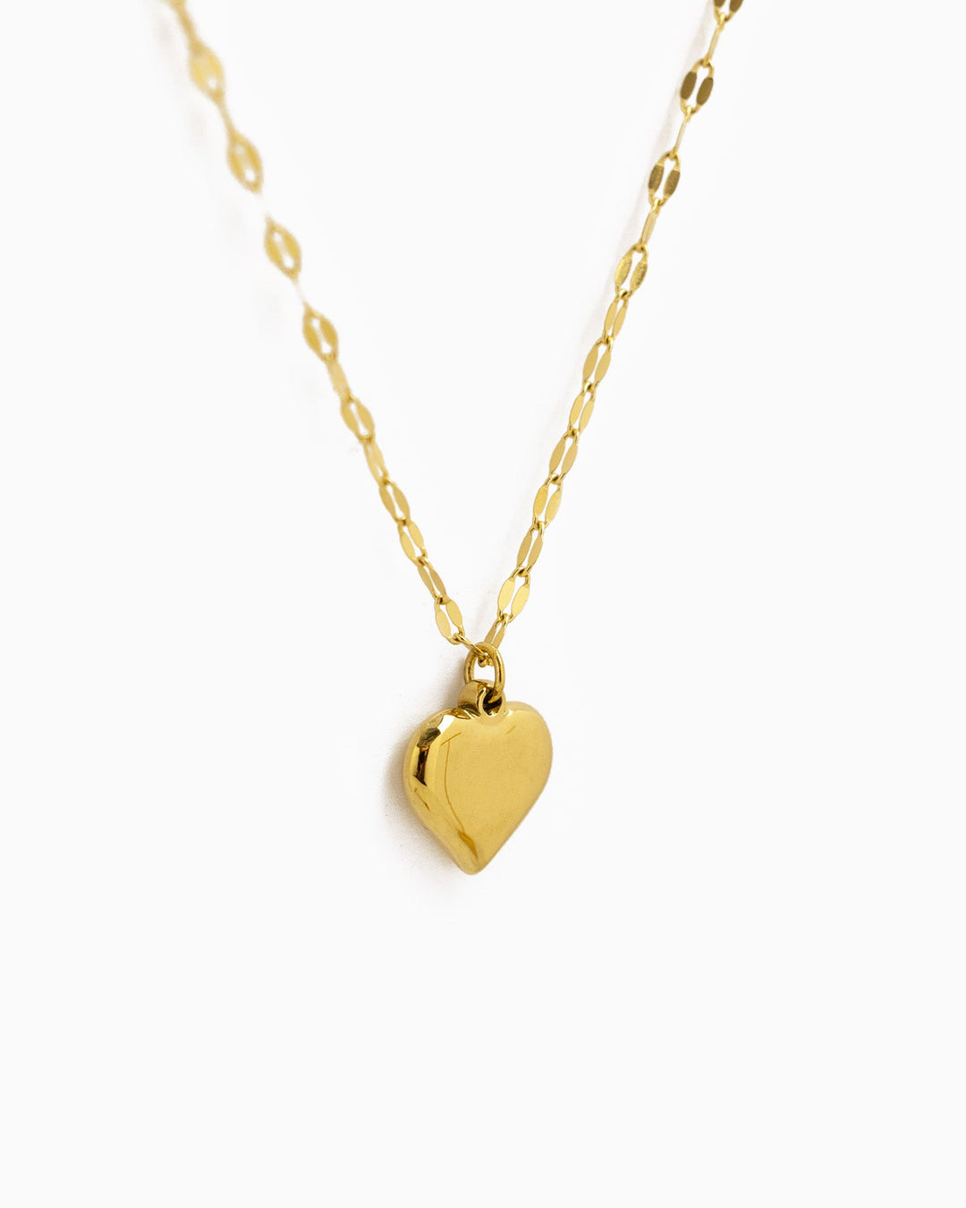 Gold stainless steel puffy heart pendant necklace with delicate oval link chain by Sessori.
