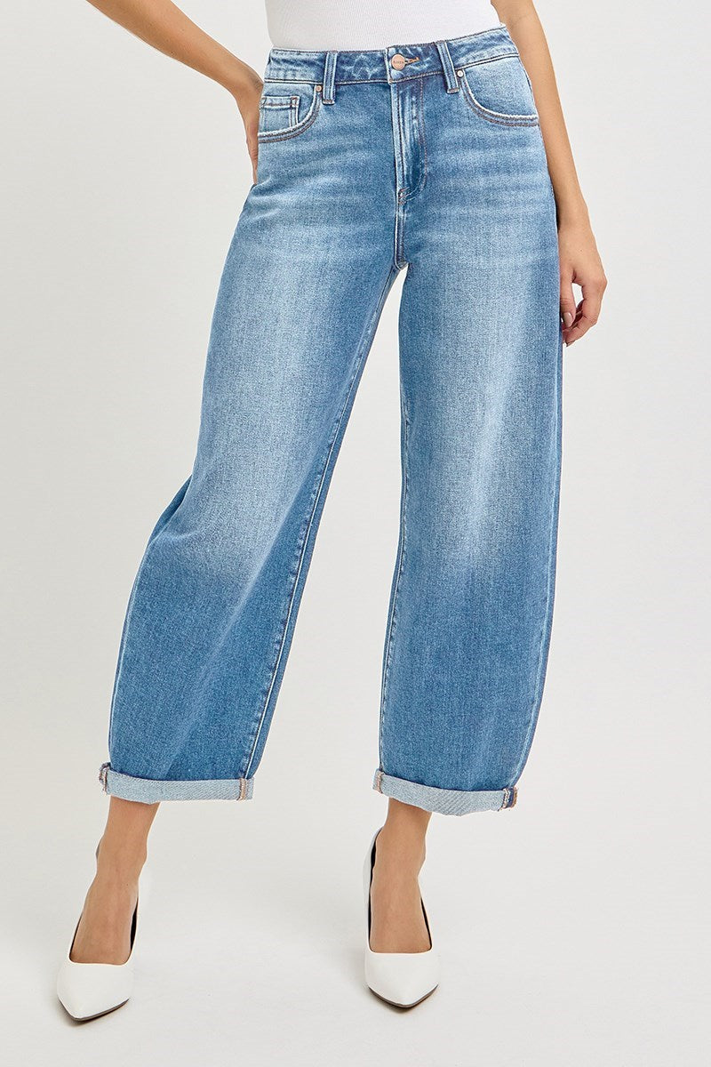 Light wash slouchy crop barrel jeans with rolled cuffs and white pointed toe heels