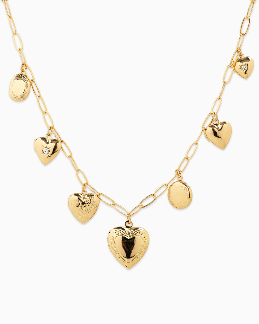 Sessori Seven Heart Locket Charm Necklace in gold with mixed heart and oval locket pendants