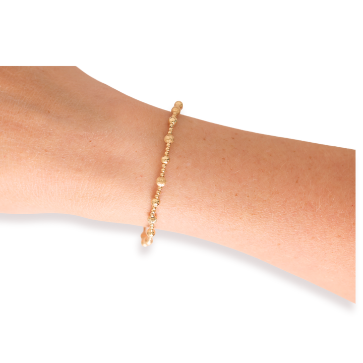 Beaded Blondes Palmer Fluted Bracelet in gold worn on a wrist, featuring textured gold beads.
