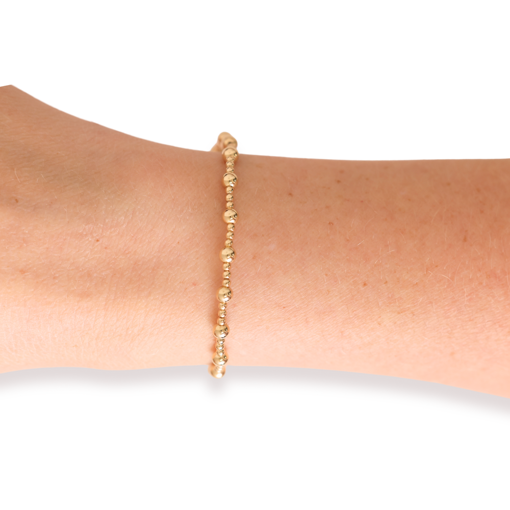Beaded Blondes Palmer Bracelet in gold beads worn on a wrist model