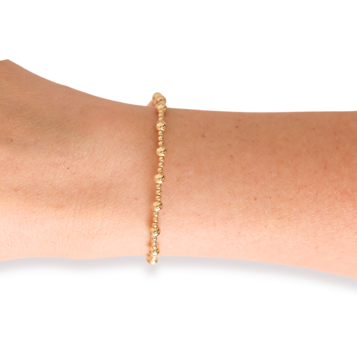 Beaded Blondes Palmer Bracelet in gold beads worn on a wrist model