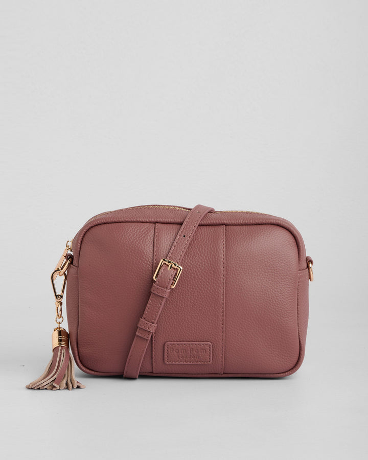 Pom Pom London dusty pink leather crossbody bag with tassel and adjustable strap