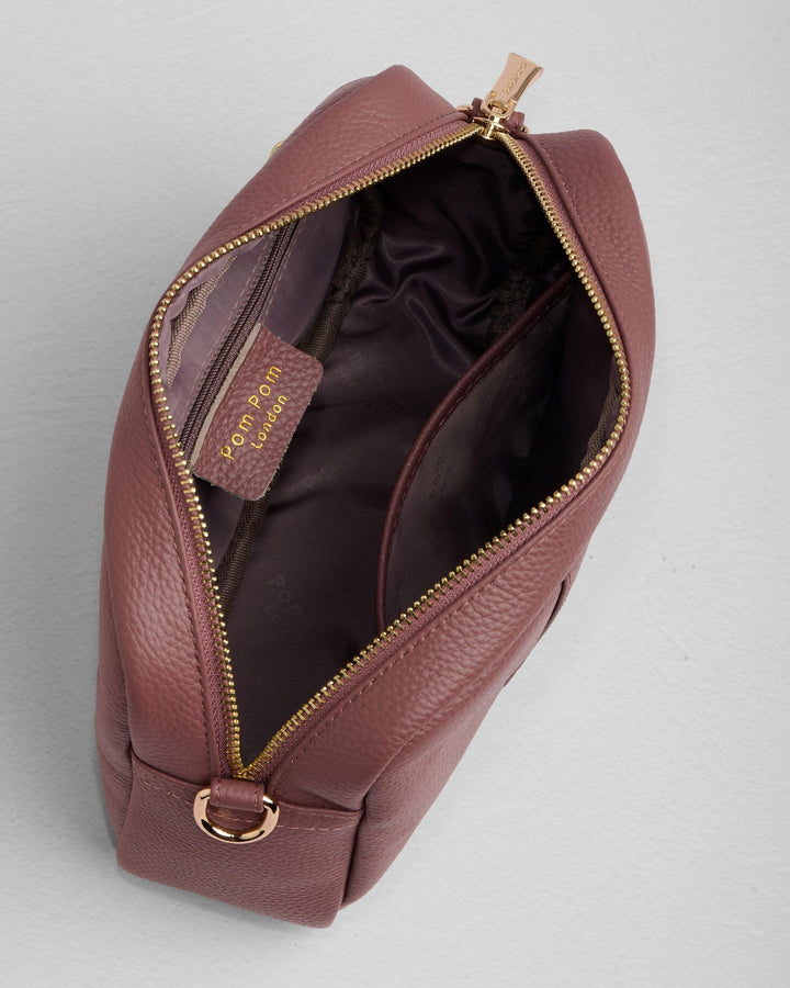Open Pom Pom London City Bag in dusky orchid leather showing interior compartments