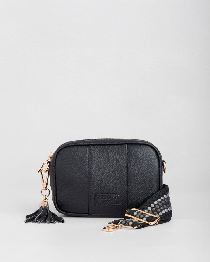 Black leather crossbody mini bag with studded strap and tassel detail