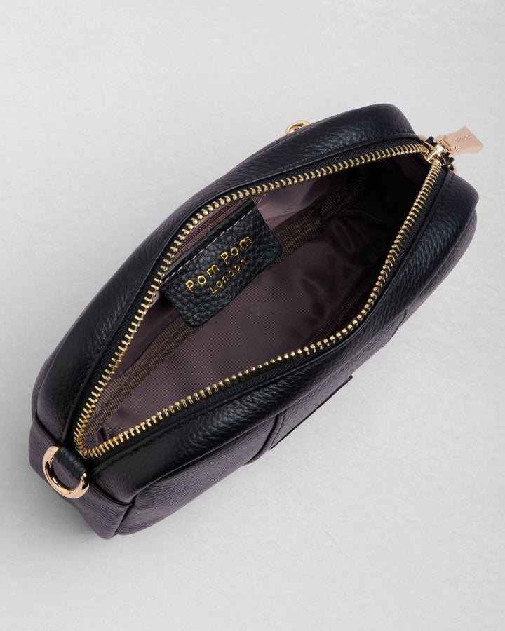 Black leather Pom Pom London City Mini Bag opened to show interior compartments