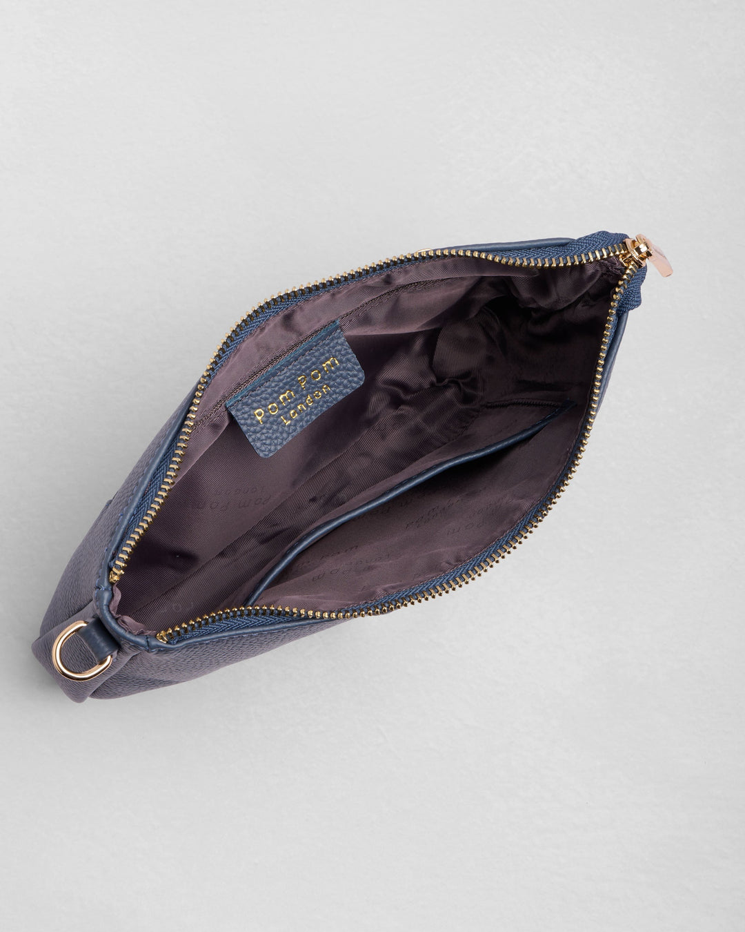 Open Pom Pom London City Slim Bag in slate blue showing interior compartments and zipper
