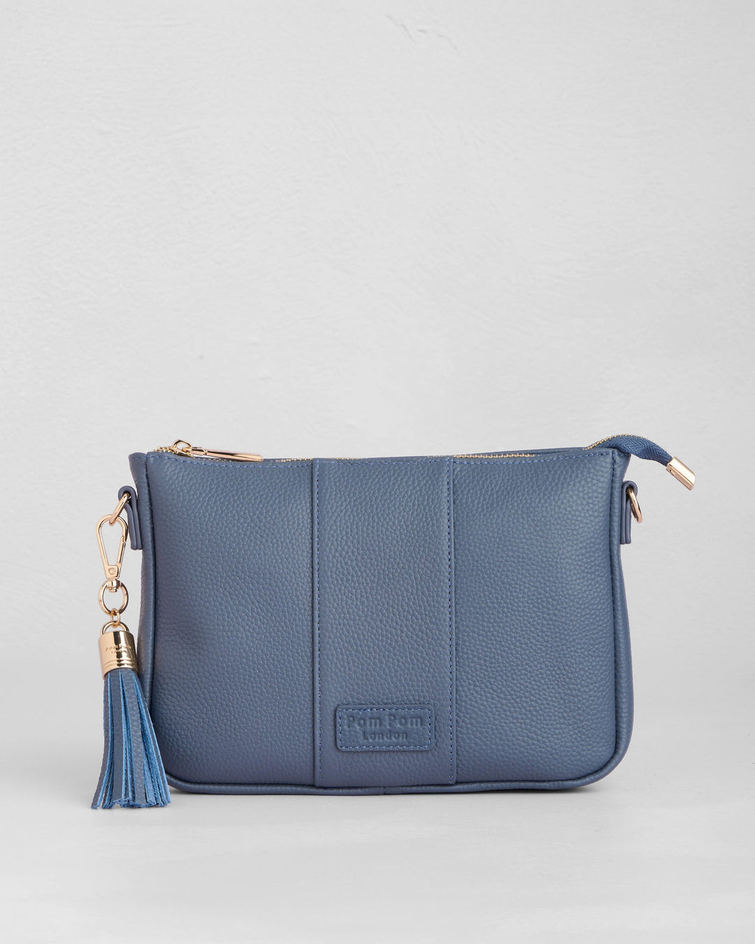 Pom Pom London City Slim crossbody bag in slate blue leather with tassel