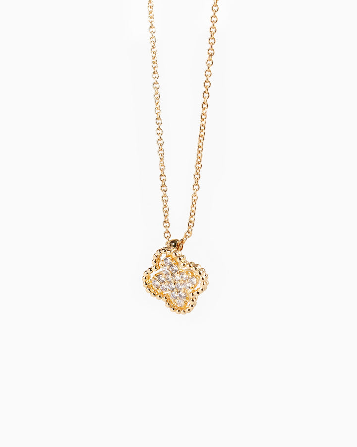 Gold chain necklace with four-leaf clover pendant featuring pavé cubic zirconia stones