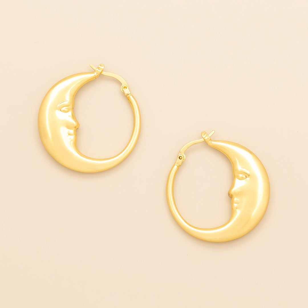 Scout Refined Icon Earrings gold crescent moon face hoop earrings, pair shown on neutral background
