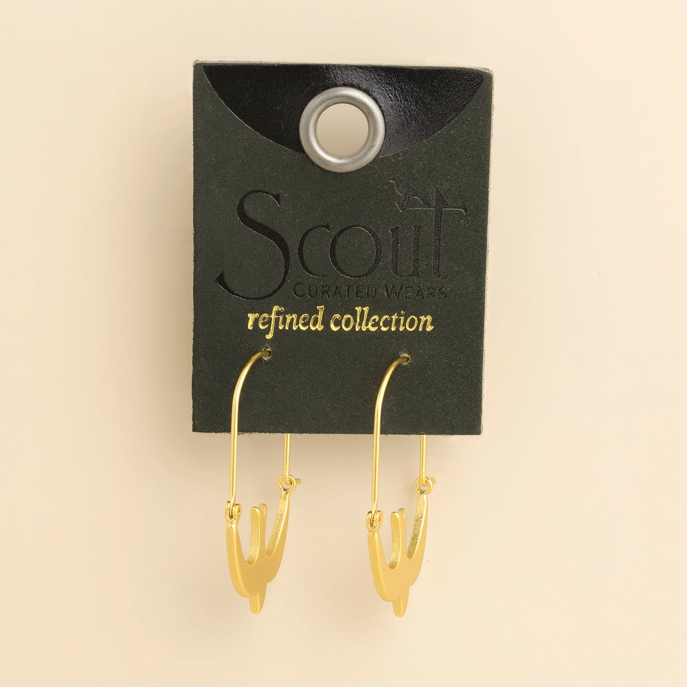 Scout Curated Wears Refined Icon gold hoop earrings with swallow charms on display card