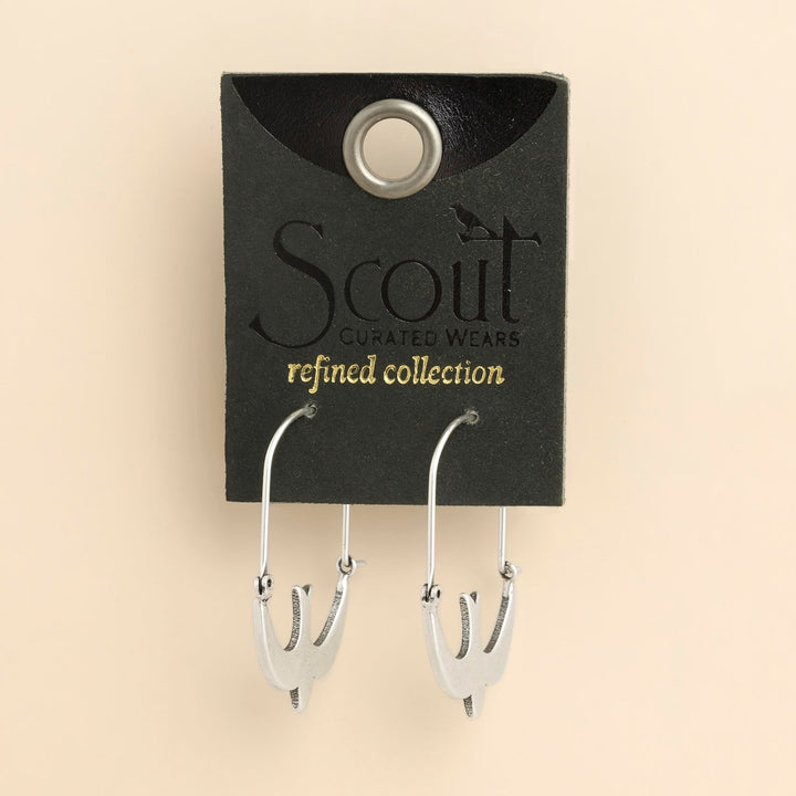 Scout Curated Wears Refined Icon silver swallow hoop earrings on branded display card