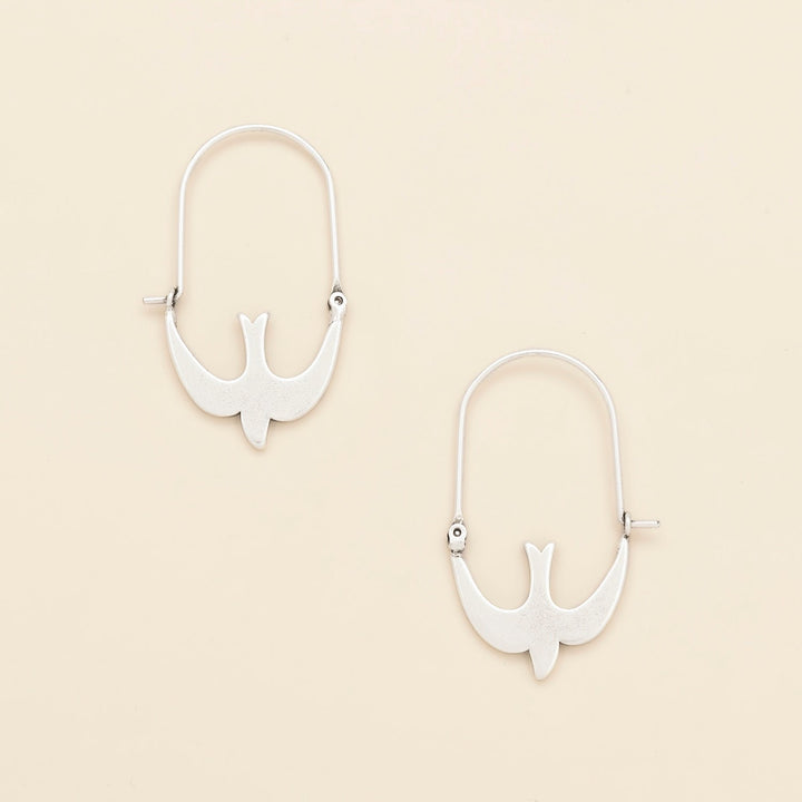 Scout Refined Icon Earrings in silver swallow hoop design, pair shown on neutral background