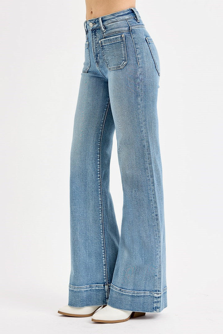 High rise wide leg flare jeans in medium blue denim with patch pockets