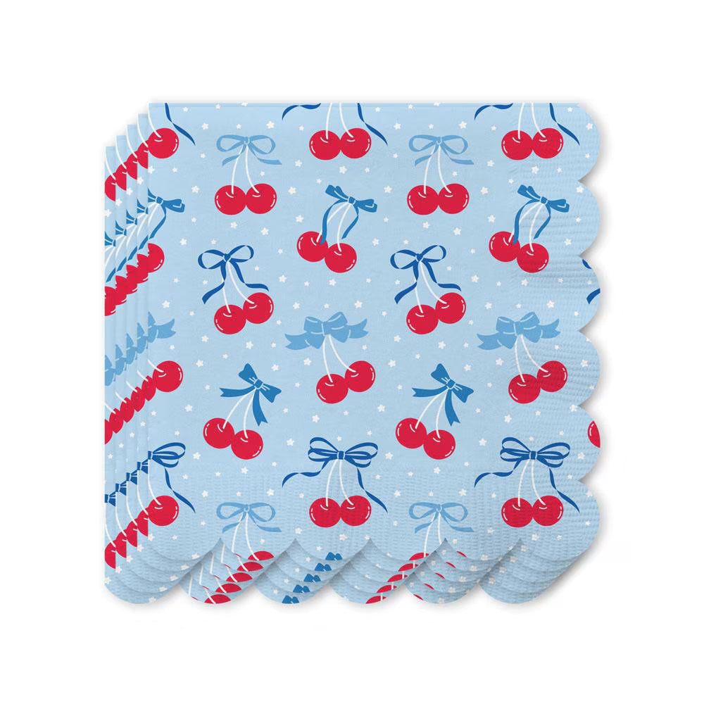 Swig Cherry Pop cocktail napkins with red cherries and blue bows on light blue background