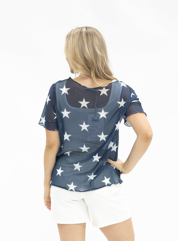 Navy blue mesh short-sleeve top with white star pattern, shown from back view