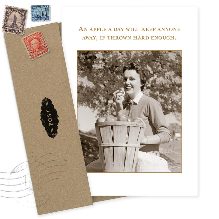 Vintage-style greeting card with sepia photograph, postage stamps, and humorous apple quote