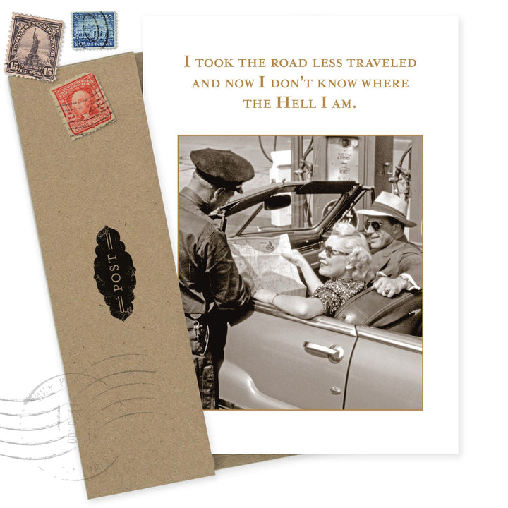 Birthday greeting card with vintage travel theme, stamps, and humorous road less traveled text