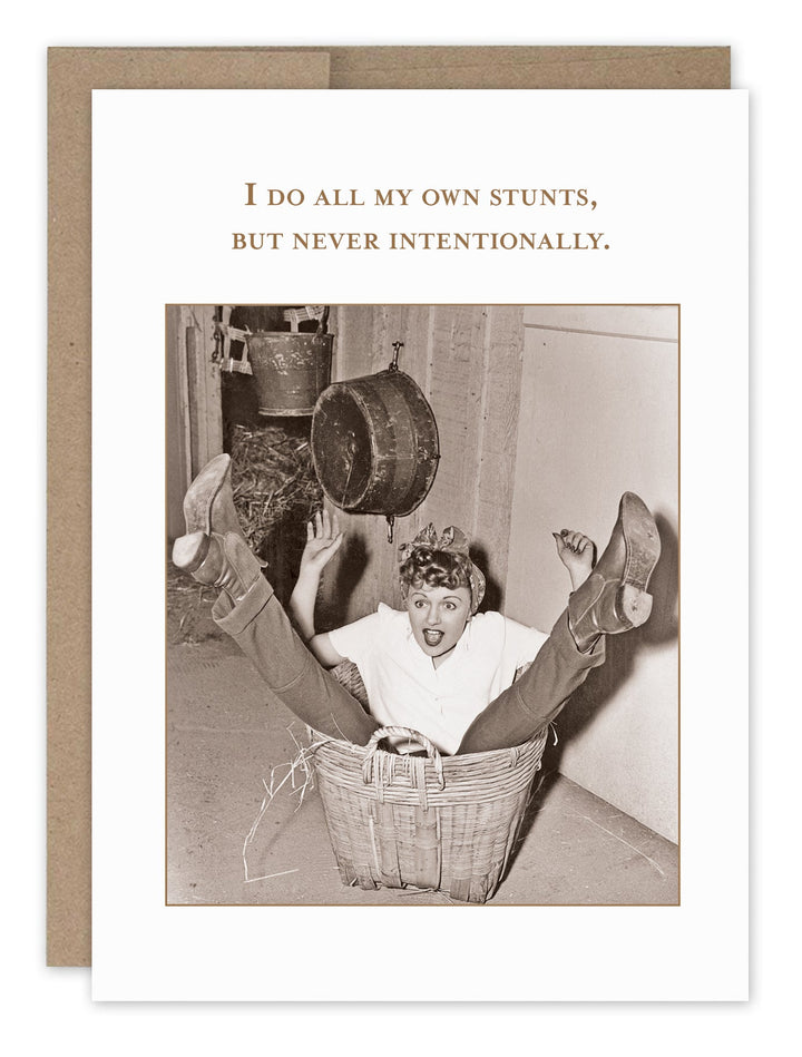 Humorous greeting card featuring vintage woman in basket with text about doing own stunts