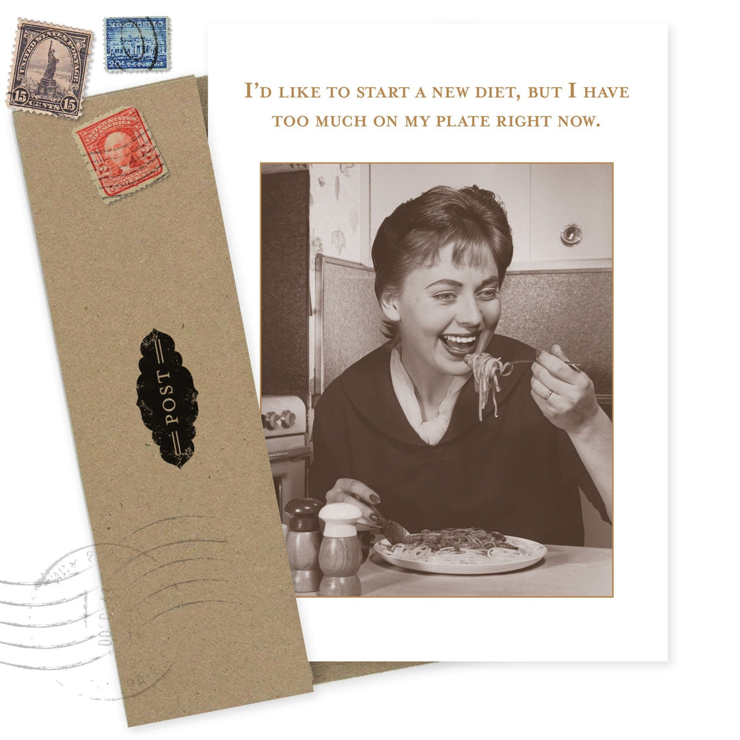 Humorous greeting card showing woman eating pasta with diet joke text