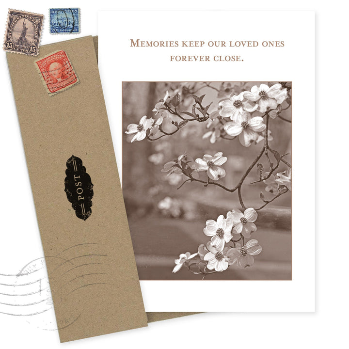 Sympathy card with vintage postcard design featuring dogwood flowers and inspirational text about memories