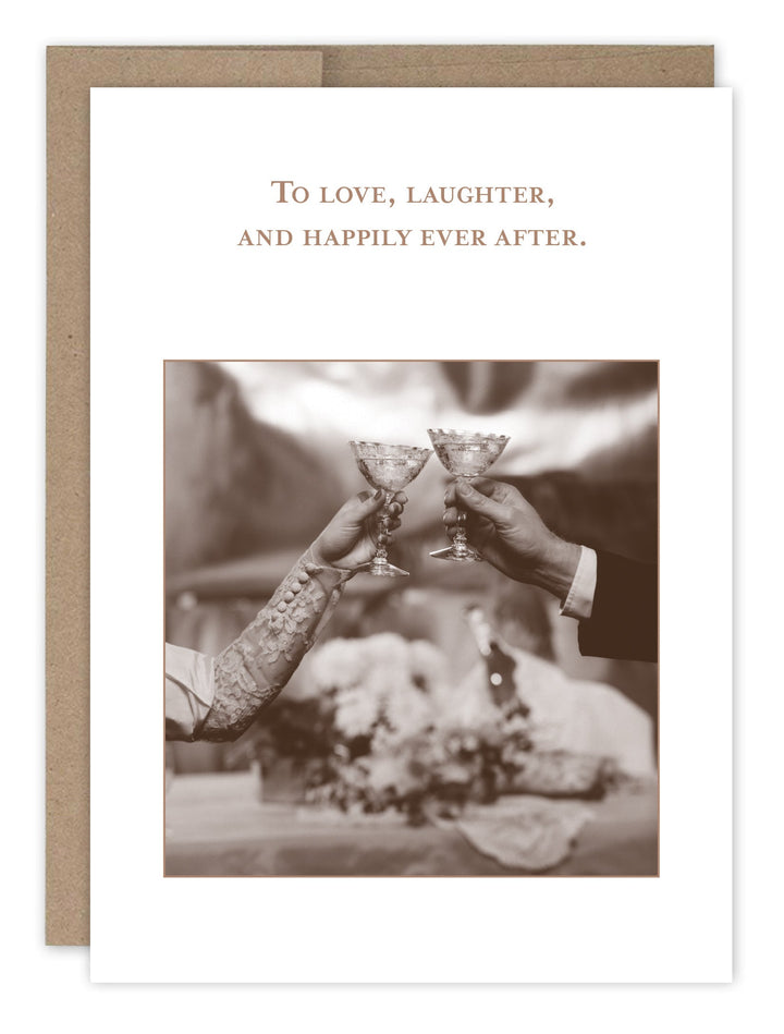 Wedding card with champagne toast photo and text 'To love, laughter, and happily ever after'