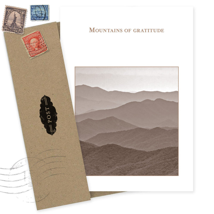 Mountains of Gratitude thank you card with layered mountain landscape and vintage postal stamps