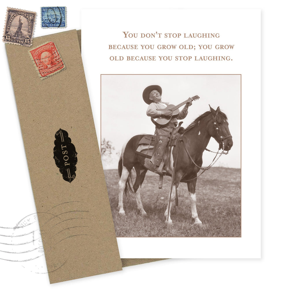 Vintage-style birthday card featuring cowboy on horse with guitar and inspirational quote about laughter