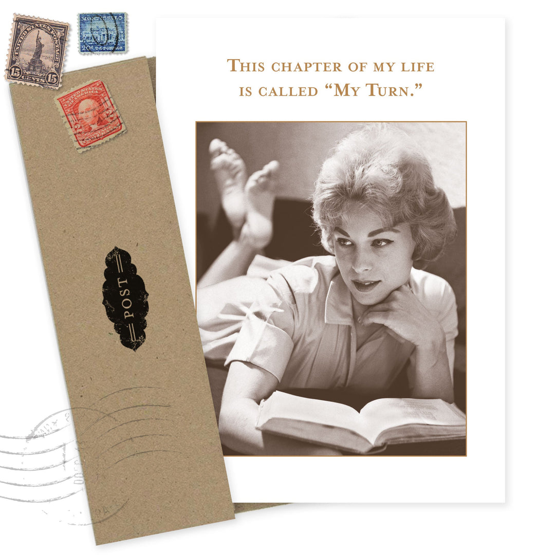 My Turn birthday card featuring vintage woman reading with postage stamps on kraft background