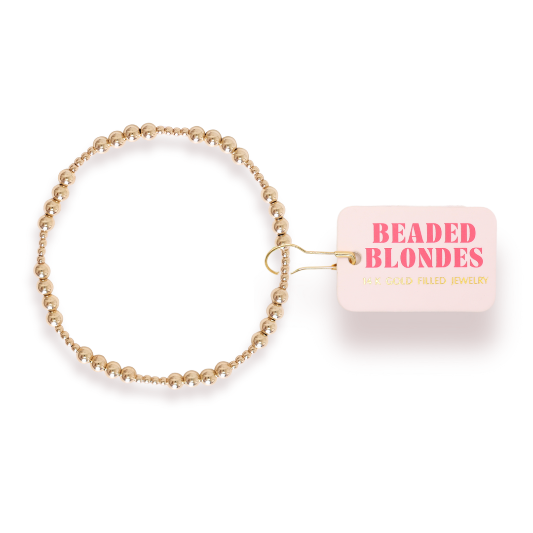 Beaded Blondes Scottie Bracelet in gold-filled beads with branded tag attached