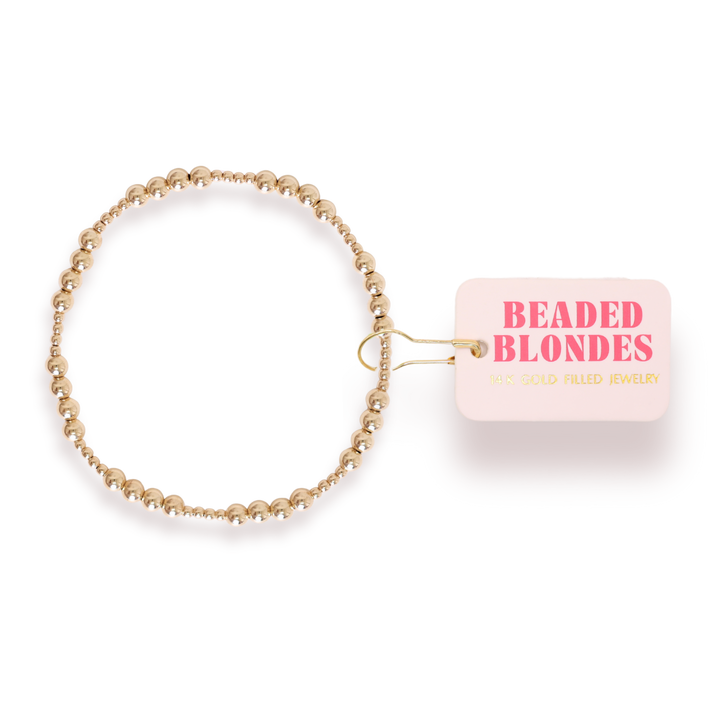 Beaded Blondes Scottie Bracelet in gold-filled beads with branded tag attached