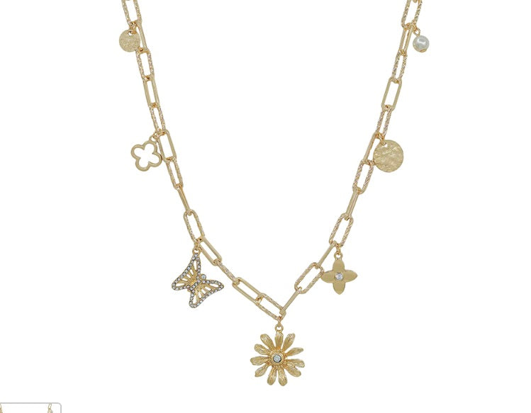 Gold chain necklace with decorative charms including flower, butterfly, and circular pendants