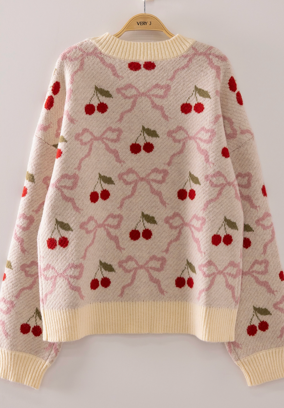 Very J cream knit sweater with red cherry and pink bow jacquard pattern