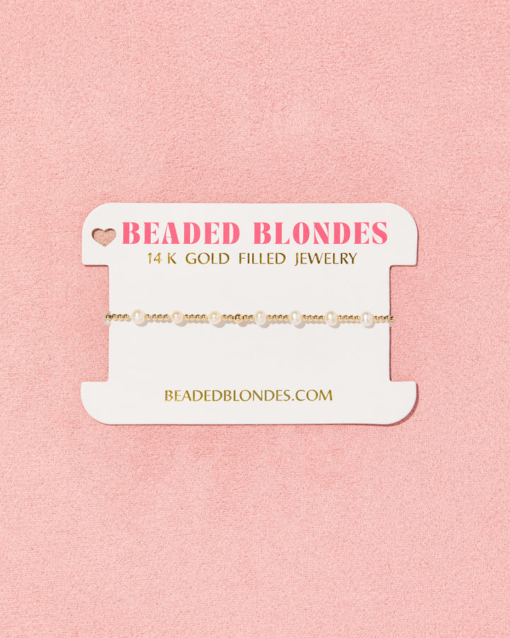 Beaded Blondes June Pearl Bracelet in gold with alternating pearl and gold beads on branded card
