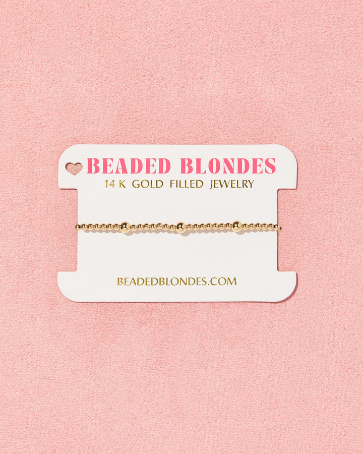 Beaded Blondes Olive Bracelet in 14K gold filled beads on branded jewelry card