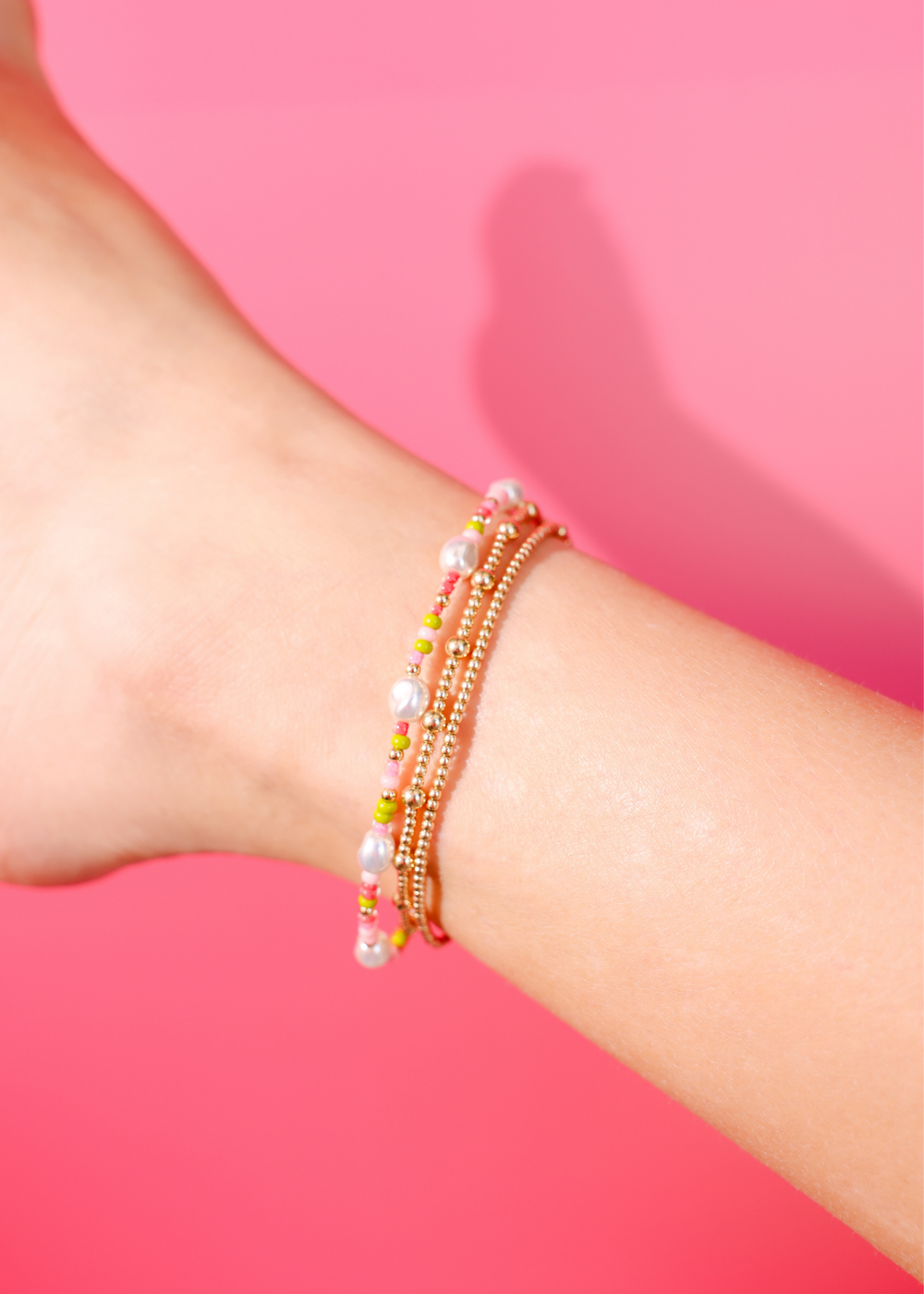 Watermelon Sprinkle Pearl Anklet with pink, green, pearl, and gold beads on wrist